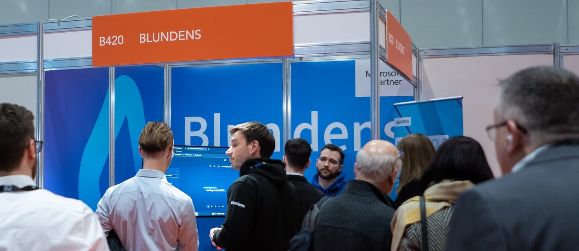 Visitors talking with the Blundens team at Big Data and AI World